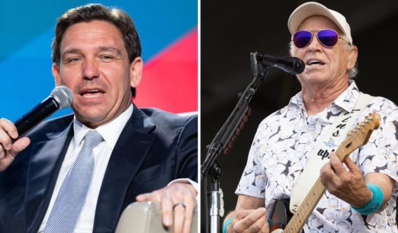 Florida Gov. Ron DeSantis speaks at an event on Aug. 18 in Atlanta. Jimmy Buffett performs on May 8, 2022, in New Orleans.