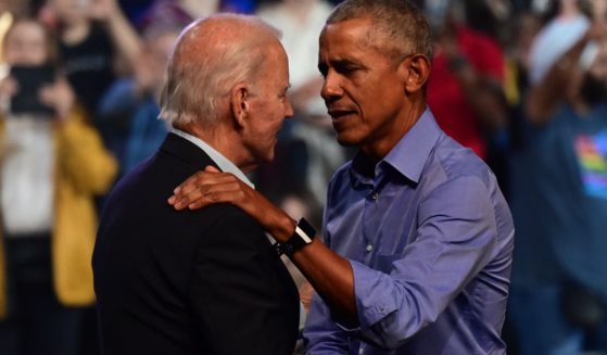 President Joe Biden and former President Barack Obama embrace on stage during a rally on Nov. 5, 2022, in Philadelphia.