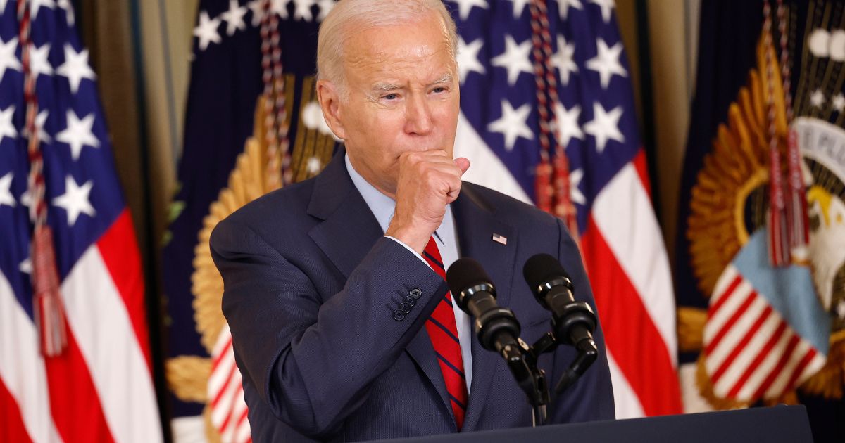 President Joe Biden coughs while delivering remarks at the White House on Wednesday in Washington, D.C.