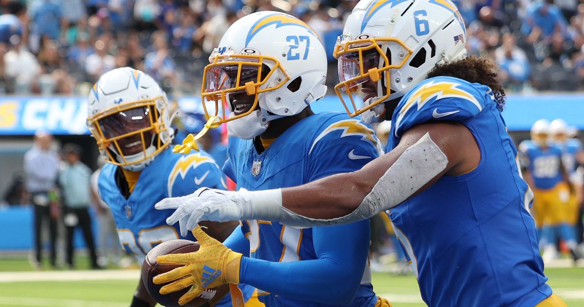 J.C. Jackson, center, of the Los Angeles Chargers celebrates an interception with teammates during the third quarter of their game against the Miami Dolphins in Inglewood, California, on Sept. 10.