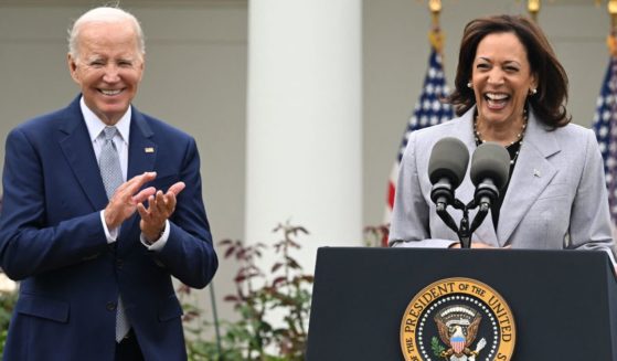 President Joe Biden applauds as Vice President Kamala Harris speaks in the Rose Garden of the White House in Washington, D.C., on Friday.