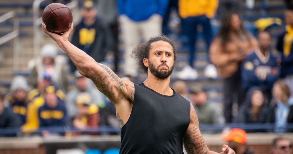 Former NFL quarterback Colin Kaepernick participates in a throwing exhibition during halftime of the University of Michigan spring football game at Michigan Stadium in Ann Arbor on April 2, 2022.