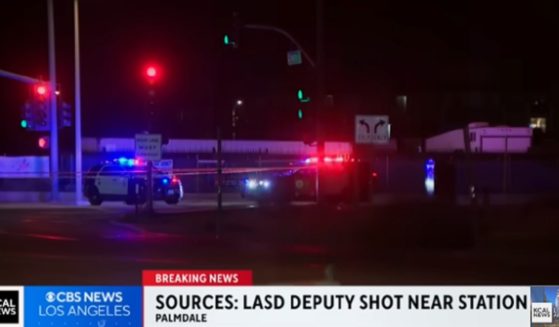 Law enforcement responds to the scene Saturday of the shooting of a Los Angeles County sheriff's deputy.
