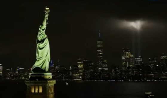 During the singing of the national anthem at the opening of "Monday Night Football," a live image of the Statue of Liberty and the World Trade Center memorial was shown, as fans sang then erupted into cheers of "USA."