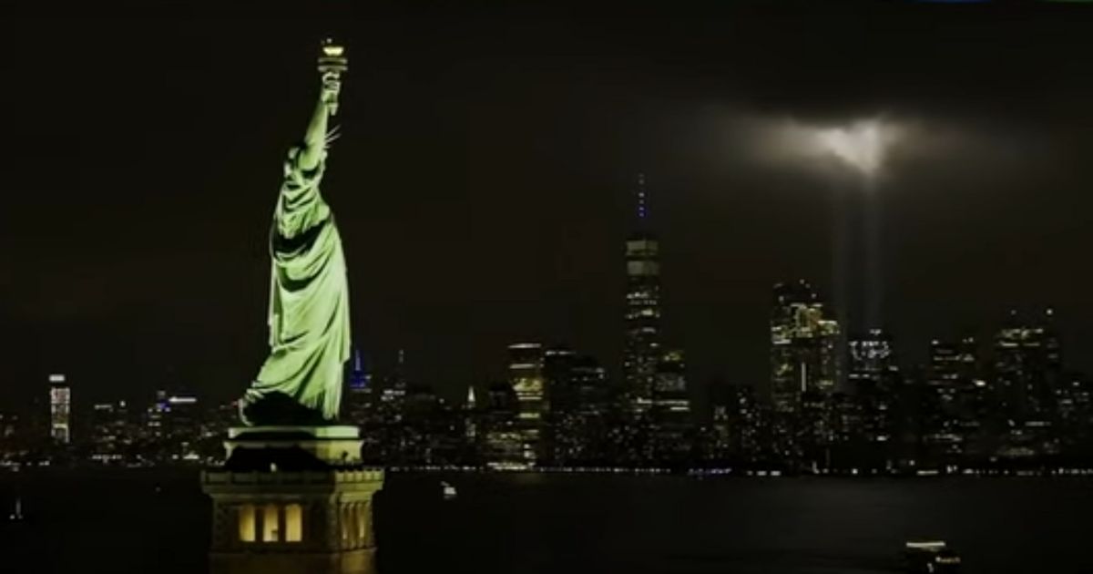 During the singing of the national anthem at the opening of "Monday Night Football," a live image of the Statue of Liberty and the World Trade Center memorial was shown, as fans sang then erupted into cheers of "USA."