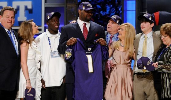 Michael Oher poses after being drafted by the Baltimore Ravens at Radio City Music Hall on April 25, 2009, in New York City.