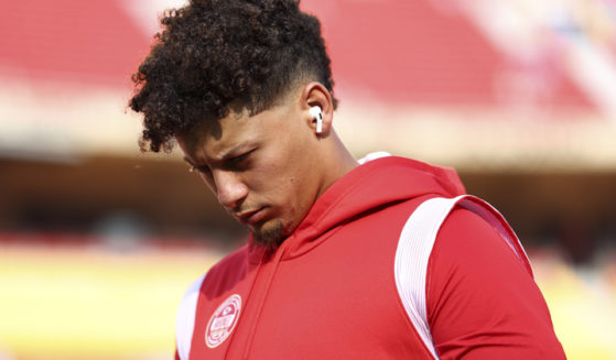 Patrick Mahomes #15 of the Kansas City Chiefs walks on the field prior to Thursday's NFL football game against the Detroit Lions in Kansas City, Missouri.