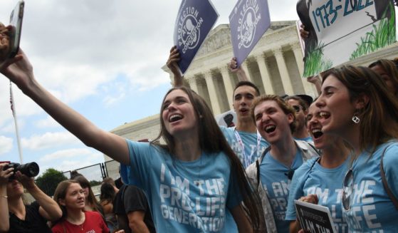 Pro-lifers celebrate outside the Supreme Court in Washington on June 24, 2022, after the court overturned Roe v. Wade.