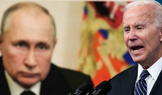 An image of Russian President Vladimir Putin, left, is displayed as President Joe Biden, right, delivers remarks on gas prices from the White House in Washington, D.C., on June 22, 2022.