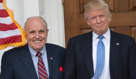 Then-president-elect Donald Trump meets with former New York City Mayor Rudy Giuliani at the clubhouse of Trump National Golf Club in Bedminster, New Jersey, on Nov. 20, 2016.