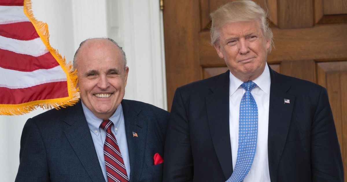 Then-president-elect Donald Trump meets with former New York City Mayor Rudy Giuliani at the clubhouse of Trump National Golf Club in Bedminster, New Jersey, on Nov. 20, 2016.