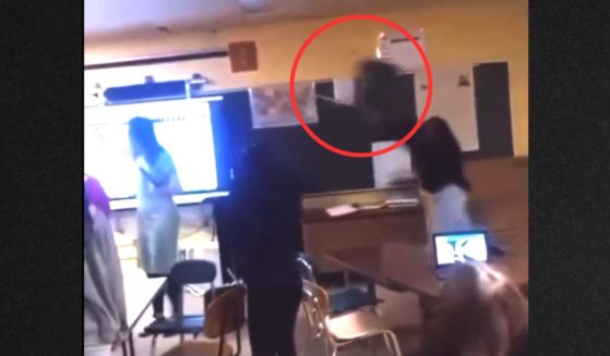 Video appears to show a screaming student throwing a chair, which hit the teacher in the head, knocking her unconscious.