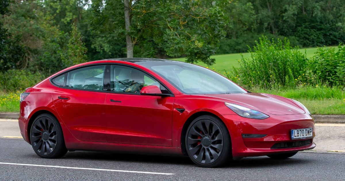 A Tesla Model 3 Performance electric car is seen on a country road in Milton Keynes, England, on Aug. 13, 2023.