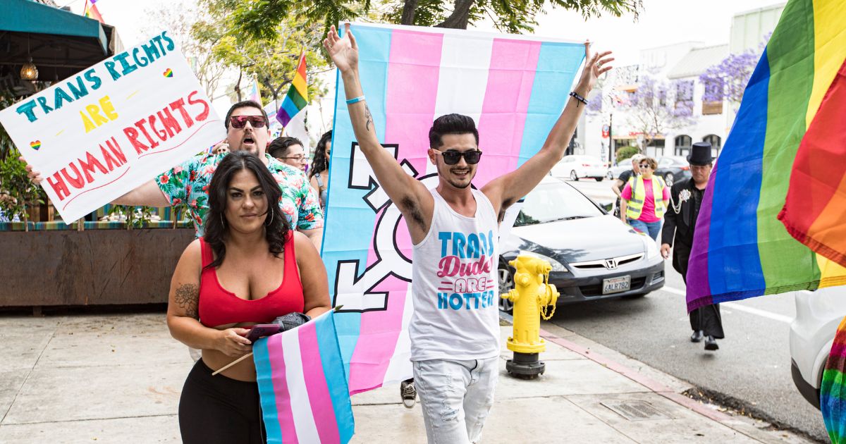 Participants march down University Avenue during the Drag March for Trans Rights at Urban Mo's Bar & Grill on June 18 in San Diego, California. New legislation could strip Californians of their parental rights for refusing to accommodate a child who wants to change genders.