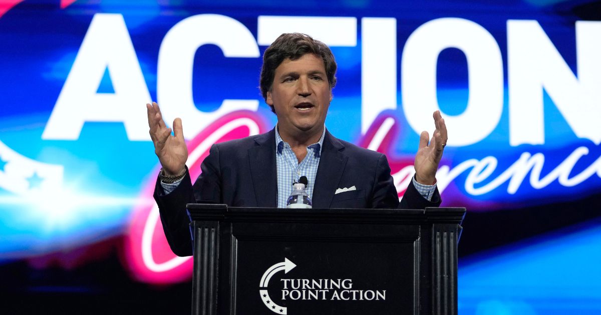 Tucker Carlson speaks at a Turning Point Action conference