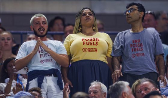 Three Freedom Rebellion demonstrators interrupt play during the match between Coco Gauff of the United States and Karolina Muchova of the Czech Republic in the semi-final of the US Open at the USTA Billie Jean King National Tennis Center on September 07, 2023 in New York City. (Frey / TPN - Getty Images)