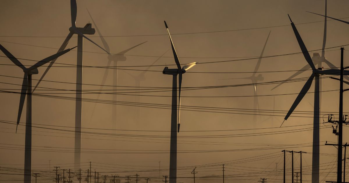 Wind Turbines are surrounded by a dust storm in Palm Springs, California, on Sunday.