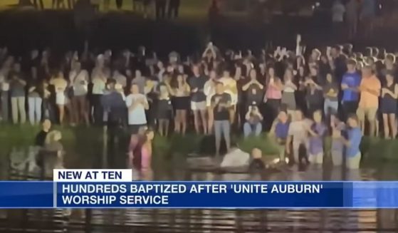 Worshippers gather for a mass baptism Tuesday at Auburn University.