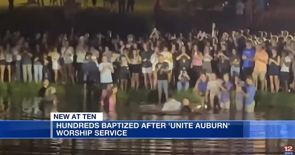 Worshippers gather for a mass baptism Tuesday at Auburn University.