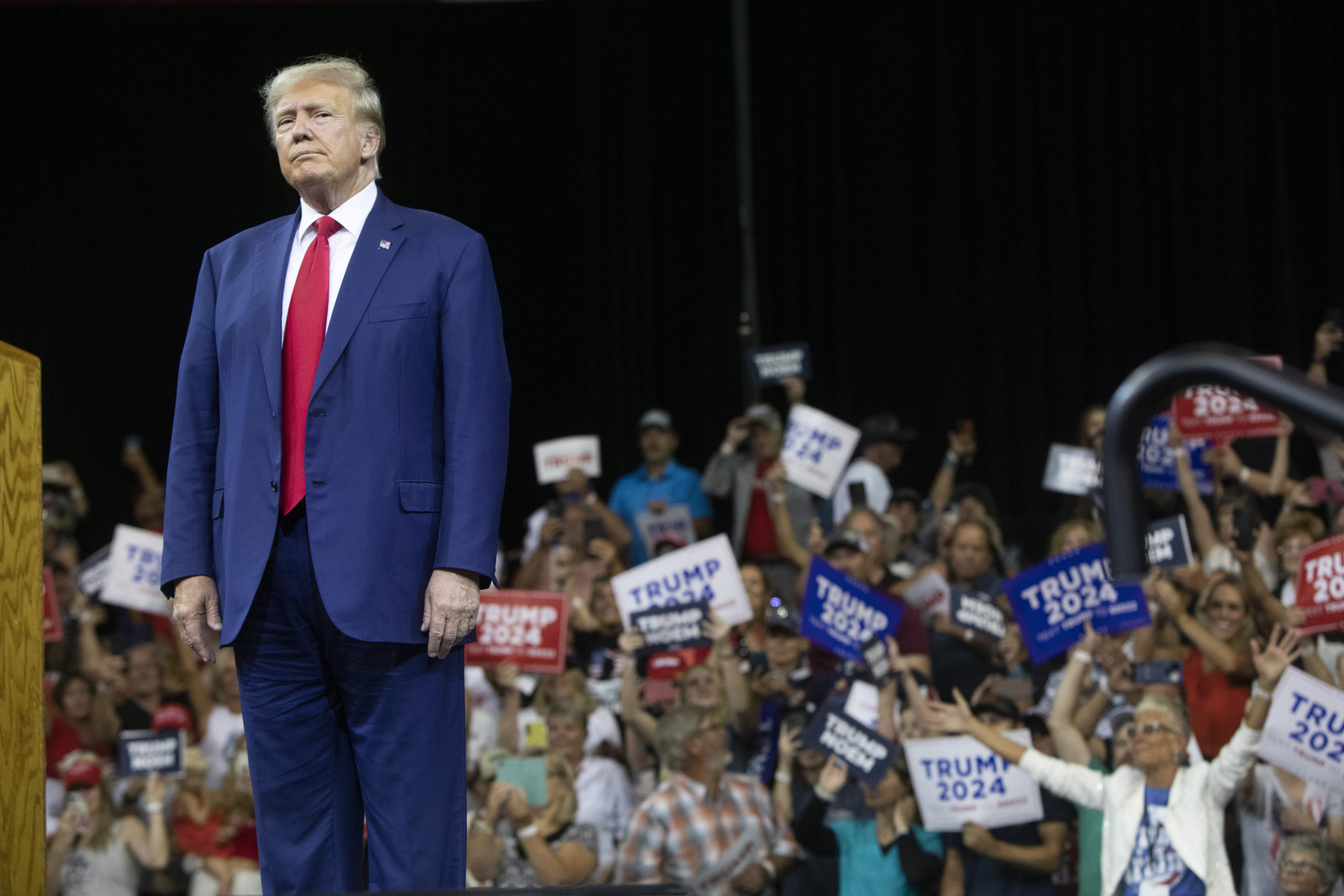 Former President Donald Trump stands as the crowd cheers at the South Dakota Republican Party Monumental Leaders rally in Rapid City, South Dakota, on Friday.