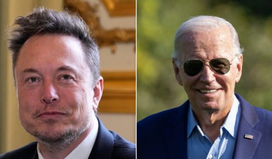 President Joe Biden is seen right and Tesla founder Elon Musk is on the left.