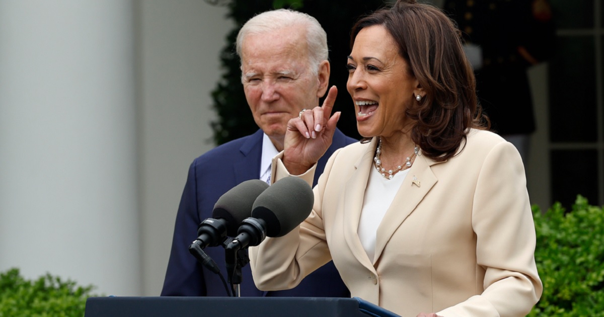 President Joe Biden looks on while Vice President Kamala Harris speaks in the White House Rose Garden in May.