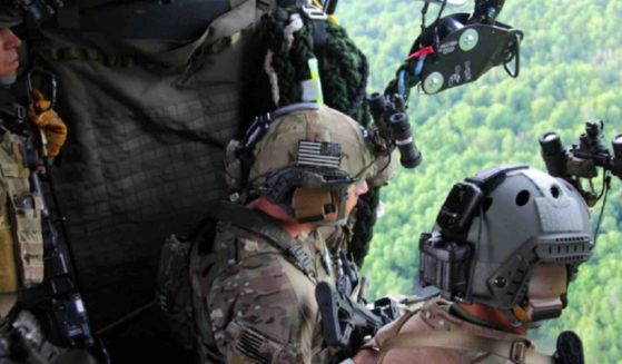 Agents from the Border Patrol Tactical Unit are pictured in a helicopter during the search for a killer who was captured Wednesday.