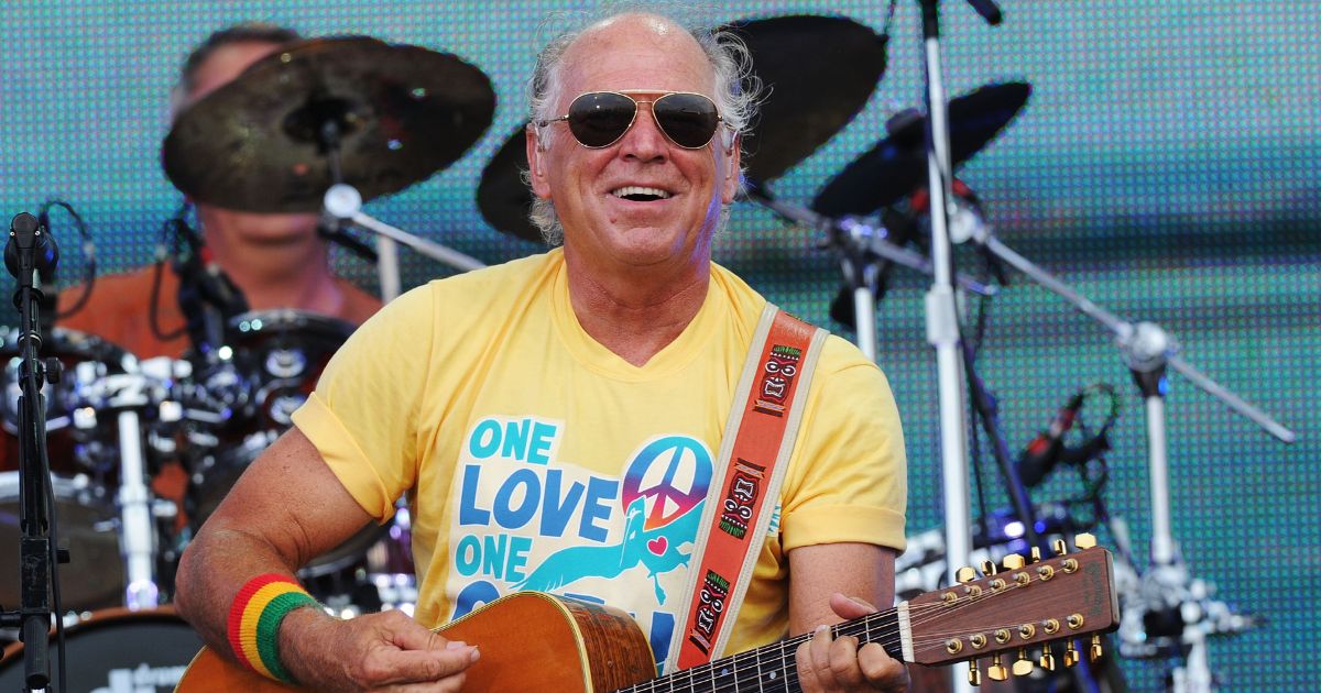 Musician Jimmy Buffett performs onstage at Jimmy Buffett & Friends: Live from the Gulf Coast, a concert presented by CMT at on the beach on July 11, 2010, in Gulf Shores, Alabama.