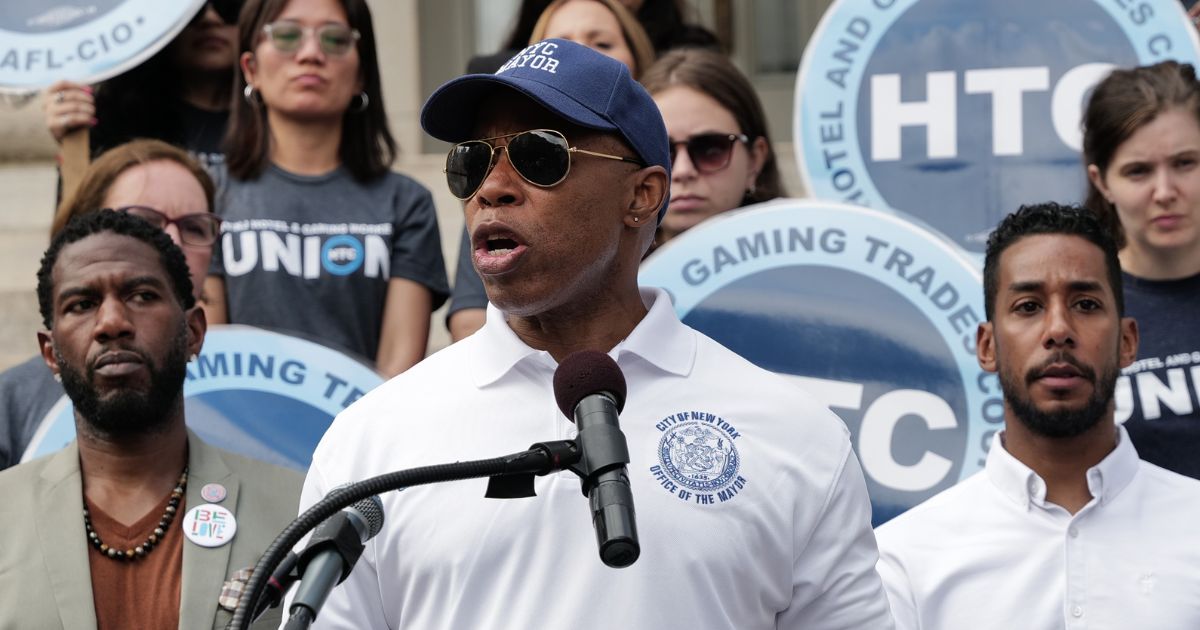 New York Mayor Eric Adams addresses the media at a rally in support of asylum seekers on August 15, 2023 in New York City.