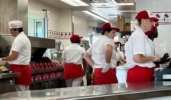 Workers at an In-N-Out burger restaurant