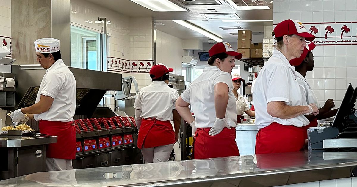 Workers at an In-N-Out burger restaurant