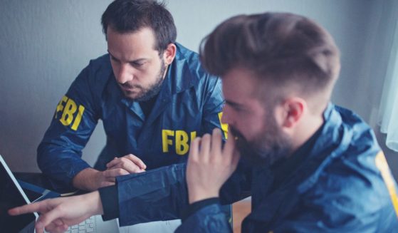 This stock image shows two FBI agents working.