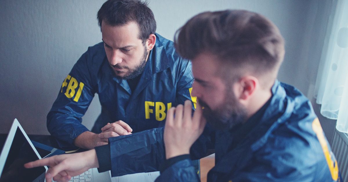 This stock image shows two FBI agents working.