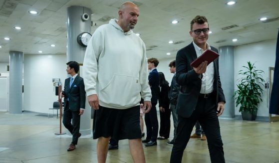 Pennsylvania Sen. John Fetterman, dressed like he's headed to the gym to work off a hangover, walks through the Senate subway on his way to a nomination vote at the Capito in June.