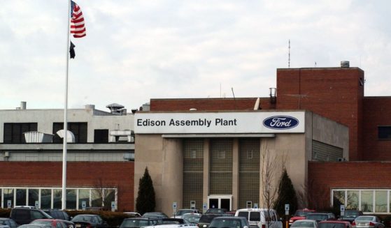 Employees' cars sit in front of the Ford Motor Companys Edison, New Jersey, assembly plant on Jan. 11, 2002.