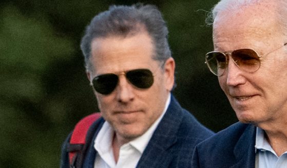 Hunter Biden and President Joe Biden are pictured in a file photo from June arriving at Fort McNair, in Washington, D.C.