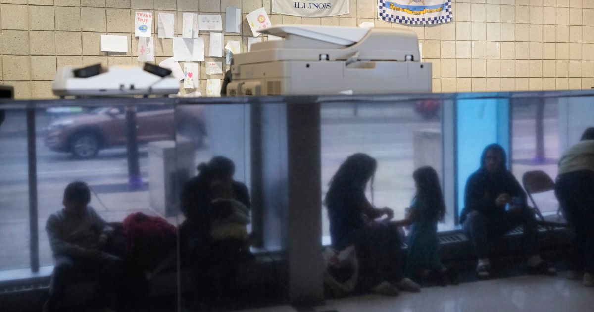 Immigrants from Venezuela taking shelter at the Chicago Police Department's 16th District station