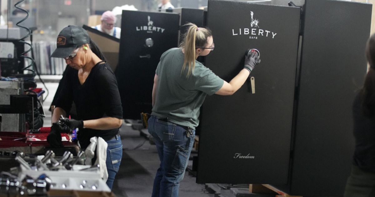 Workers assemble safes at Liberty Safe Company in a March 2022 file photo in Payson, Utah.