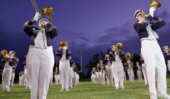 This stock image shows a generic marching band.