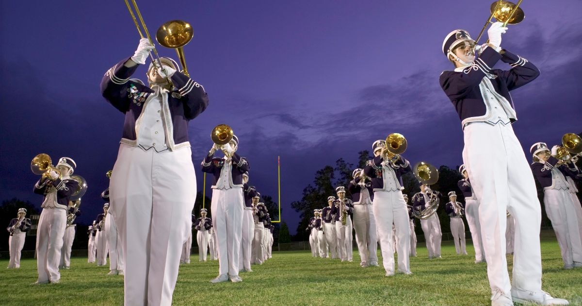 This stock image shows a generic marching band.