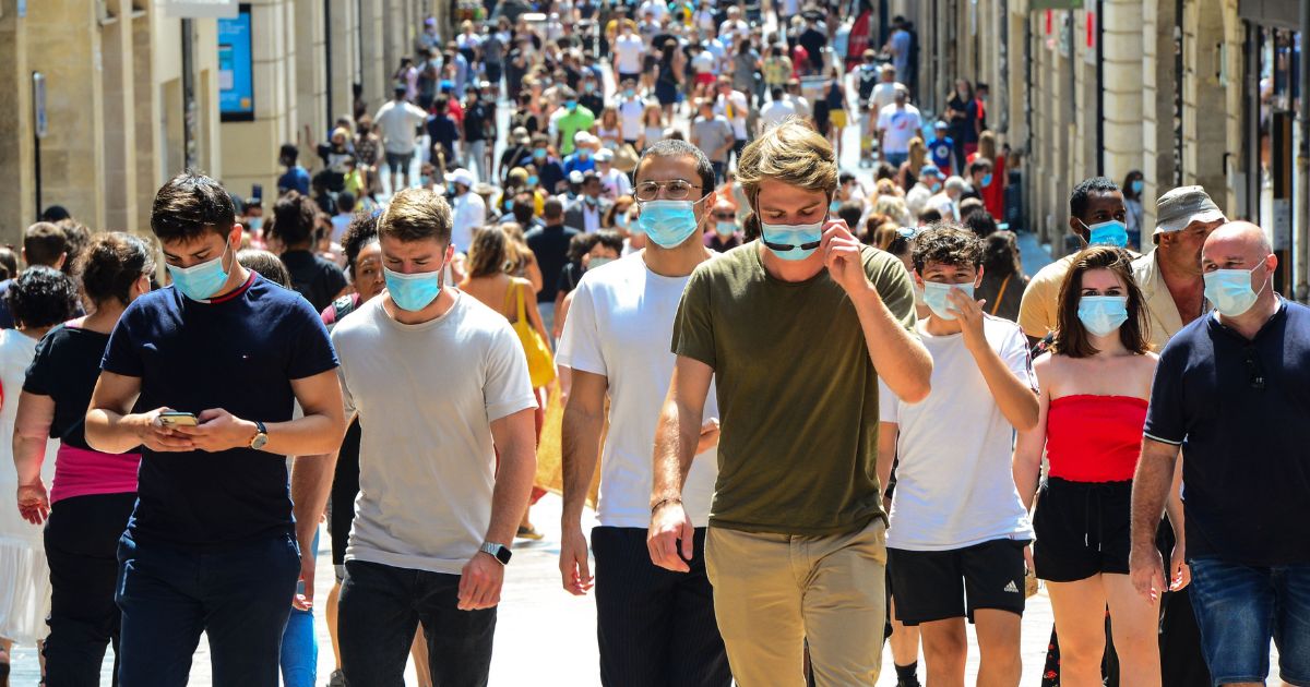 People stroll down Bordeaux's main shopping street Sainte-Catherine, where wearing a mask is compulsory as of Aug. 15, 2020, to prevent the spread of the novel coronavirus COVID-19.