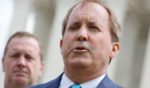 Texas Attorney General Ken Paxton talks to reporters after the U.S. Supreme Court heard arguments in their case about Title 42 on April 26, 2022, in Washington, D.C.