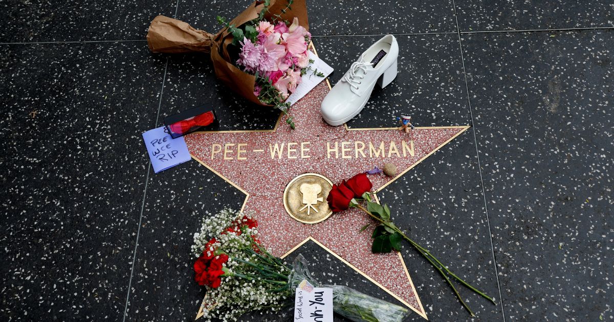 Flowers and memorabilia placed on the star of Pee-Wee Herman on the Hollywood Walk of Fame as Hollywood Remembers Actor Paul Reubens on July 31, 2023 in Hollywood, California.