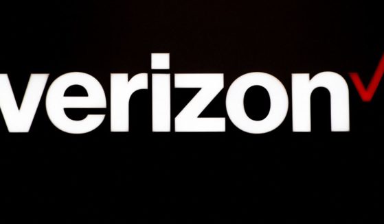 A Verizon logo hangs from a beam during the Mobile World Congress on the third day of the MWC in Barcelona, on March 1, 2017.