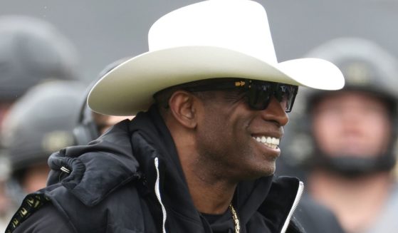 Head coach Deion Sanders of the Colorado Buffaloes watches as his team warms up prior to their spring game at Folsom Field on April 22 in Boulder, Colorado.