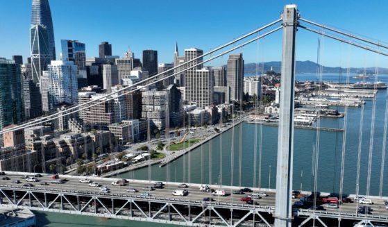 In an aerial view, cars drive by the San Francisco skyline as they cross the San Francisco-Oakland Bay Bridge on October 27, 2022 in San Francisco, California. (Justin Sullivan / Getty Images)