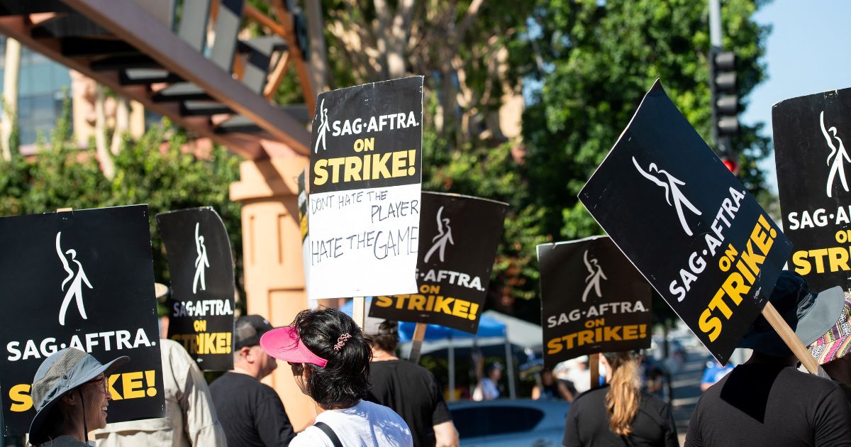 Members of the Writers Guild of America and the Screen Actors Guild march in Burbank, California, on Aug. 16.