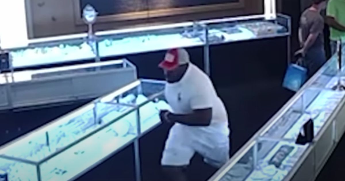 An alleged theft runs out of a jewelry store in Massachusetts in July.