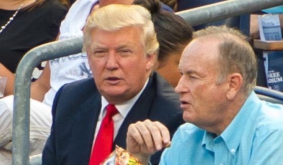 Donald Trump (L) and Bill O'Reilly attend the Baltimore Orioles vs New York Yankees game at Yankee Stadium on July 30, 2012 in New York City.