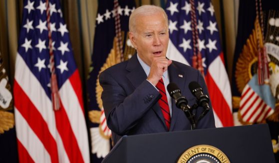 U.S. President Joe Biden coughs while delivering remarks to an audience of leaders from the International Longshore and Warehouse Union (ILWU) and the Pacific Maritime Association (PMA) during an event to congratulate them on finalizing a new labor contract in the State Dining Room at the White House on September 6, 2023 in Washington, DC.